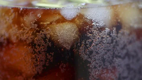 Closeup bubbles in a glass of cola Stock Footage 75424718