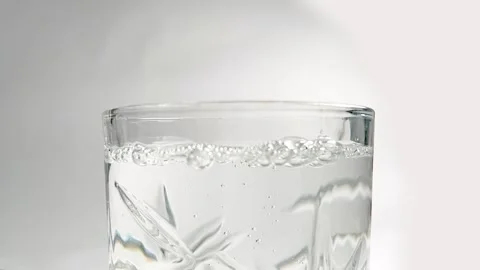 Closeup of bubbles in water, drinking water in a glass Stock Footage 275261223
