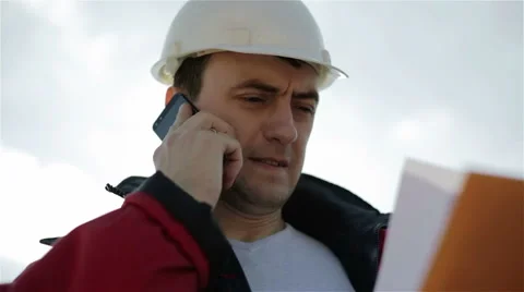 Closeup builder face on the background of the cloudy sky. Stock Footage 62769927