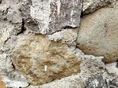 Closeup of the building foundation surface, sandstone and cement. Stock Photos