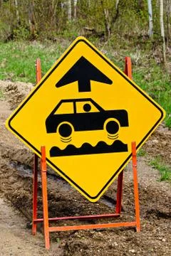 Closeup of a bumpy road ahead sign Stock Photos