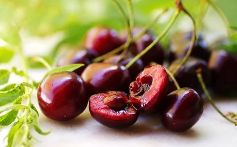 Closeup of a bunch of cherries on table Stock Photos