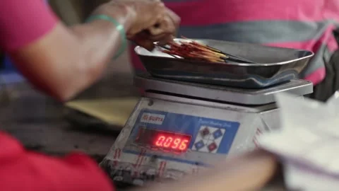A closeup of a bunch of incense sticks being weighed each time for packing Stock Footage 241653172