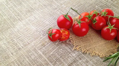 Closeup of bunch of wet tomatoes and rosemary Stock Footage 37409765