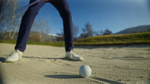 Closeup bunker shot hitting golf ball from sand in Sion Switzerland Stock Footage 332032928