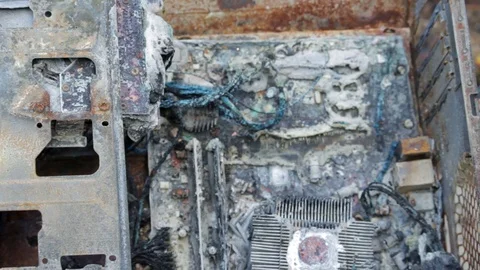 Closeup of a burned desktop computer with scorched computer parts Stock Footage 93420651