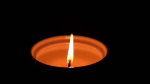 Closeup of burning candle in dark background. Stock Footage 169670058