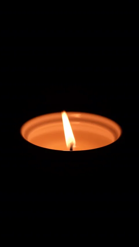 Closeup of burning candle in dark background. Stock Footage 169670108