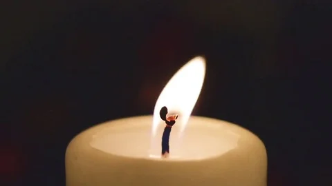 Closeup of a burning candle Stock Footage 74724578