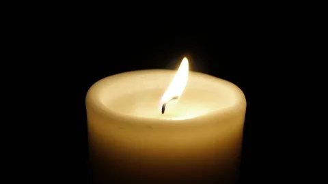 Closeup of burning candle isolated on black background. Stock-Footage 87778161