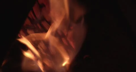 Closeup of a burning log with glowing embers and flames 스톡 동영상 301695840