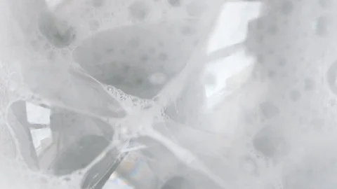 Closeup Bursting bubbles from soap, shampoo or cleanser Stock Footage 108591847