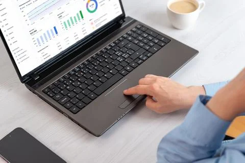 Closeup of business analytics interface and laptop touchpad in minimal work.. Stock Photos