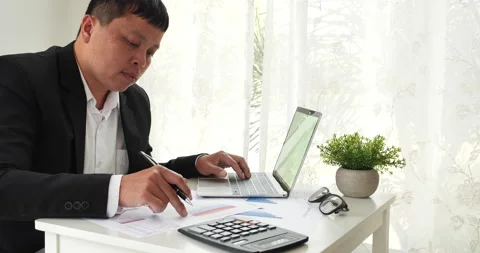 Closeup businessman hands working use laptop finance business document reading r Stock Footage 234176308
