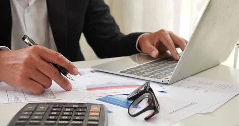 Closeup businessman hands working use laptop finance business document reading r Stock-Footage 234183130