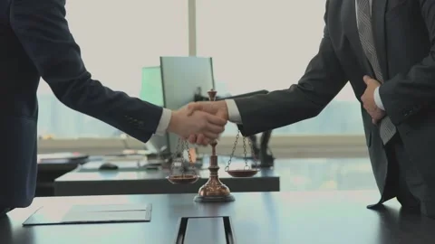 Closeup of Businessmen Shaking Hands Over Conference Table Stock-Footage 337994055