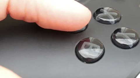 Closeup of buttons on a video game controller being pressed Stock Footage 71896324
