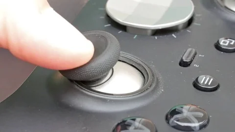 Closeup of buttons on a video game controller being pressed Stock Footage 71896702