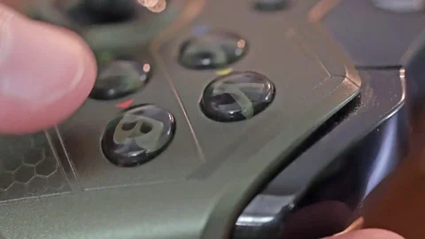 Closeup of buttons on a video game controller being pressed Stock Footage 71897038