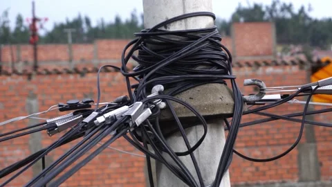 Closeup of cable connections on a concrete light pole in the Peruvian highlands Stock Footage 164617038
