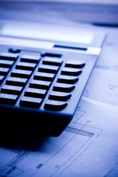 Closeup of calculator with floor plan on the table Foto stock