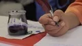Closeup of calligraphy session at Medieval masquerade, woman writing love letter HD Footage