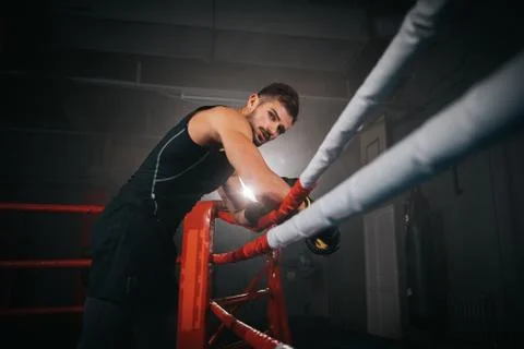 Closeup to the camera in a boxing ring great looking guy get ready for a boxing Foto stock