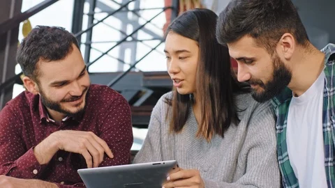 Closeup to the camera charismatic students preparing the project for the college Stock Footage 122589421