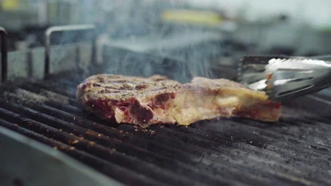 Closeup to the camera delicious beef steak cocked the main chef take off from Stock Footage 156175679
