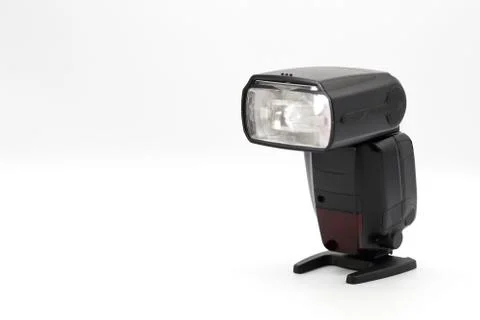 Closeup camera flash on isolated background. Stock Photos