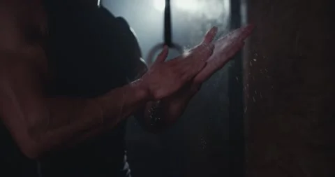 Closeup to the camera good looking guy with strong body using the powder on his Video stock 138110651