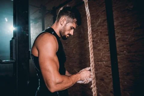 Closeup to the camera good looking guy with strong body using the powder on his Stock Photos