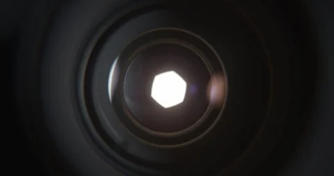 Closeup of Camera Lens Aperture Gradually Opening to Reveal Bright Light Stock Footage 346651844