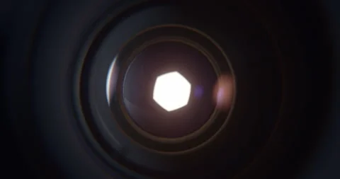 Closeup of Camera Lens Aperture Gradually Opening to Reveal Bright Light Stock Footage 346651951