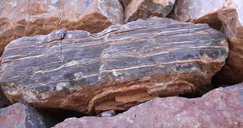 Closeup camera motion on black and white color layered rock with cracks Stock Footage 317268789