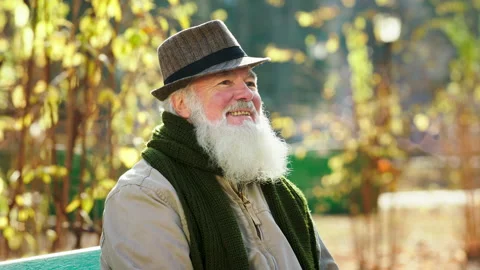 Closeup to the camera portrait of old man very charismatic smiling large while Stock Footage 166634722