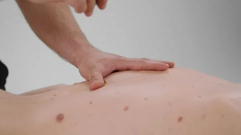 Closeup to the camera at spa salon the masseur add some oil massage on the Stock Footage 210232773