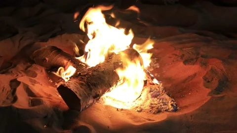 Closeup of a campfire burning in the desert Stock Footage 144034886