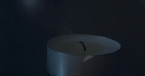 Closeup of a Candle being Extinguished Stock Footage 101373388