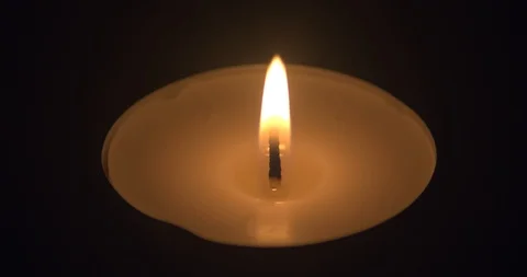 Closeup of a Candle Burning in the Darkness Stock Footage 101362881
