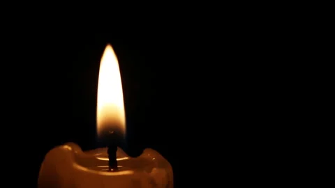 Closeup candle is burning, the fire is swaying in the wind and goes out Stock Footage 100558098