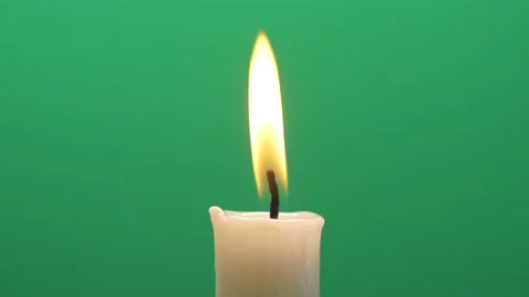 Closeup candle fire flame burning on chroma key green screen background 4K video Stock Footage 144971119