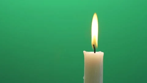 Closeup candle fire flame burning on chroma key green screen background 4K video Vídeos de archivo 148251701