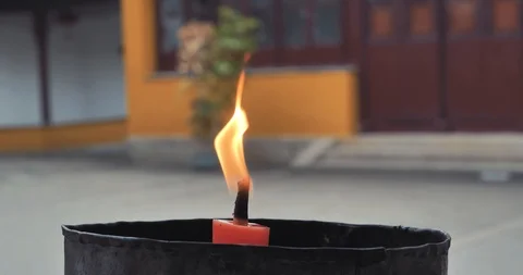 Closeup of candle flame in buddhist temple Stock Footage 89443560