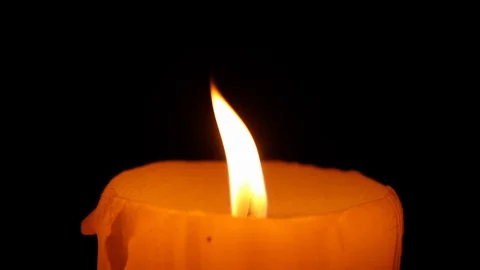 Closeup on candle flame light on black background Stock Footage 101839344