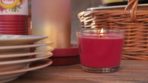 Closeup of Candle in Wind on a Garden Table Stock Footage 171662102