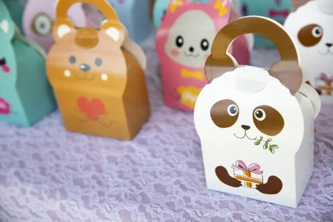 A closeup of candy boxes with funny characters on them under sunlight with a  Stock Photos