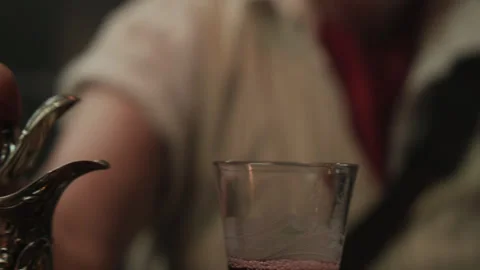 Closeup of a Captain pouring wine on the ship 스톡 동영상 259627671