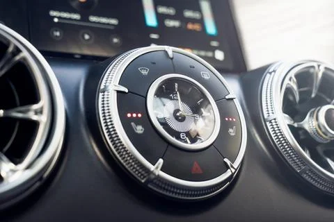 Closeup Car Analog Clock of a modern car dashboard, showcasing stylish ventil Stock Photos