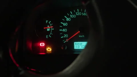 Closeup of car dashboard featuring active warning icons and needle positions 스톡 동영상 328378449